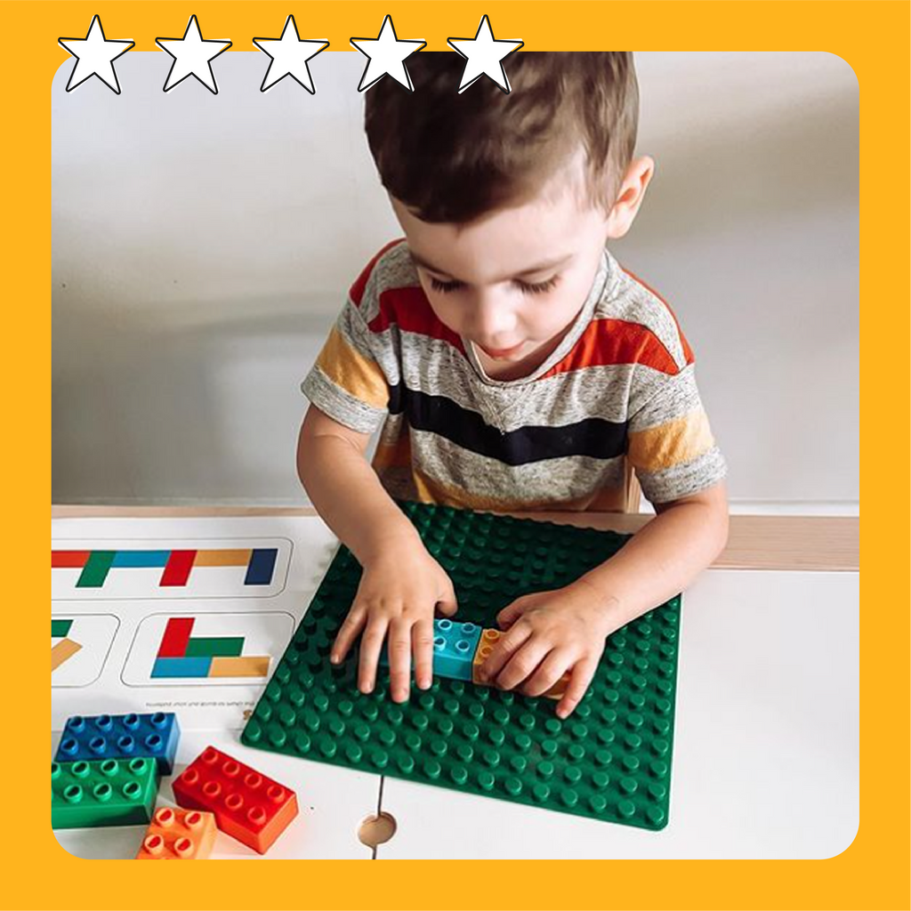 A kid aged around 4 years old playing with our building blocks and pattern cards