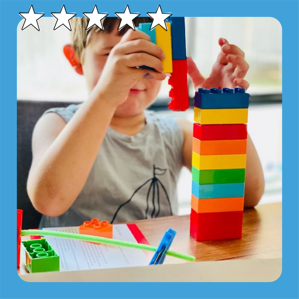 A kid aged around 4 years old playing with our building blocks and memory cards